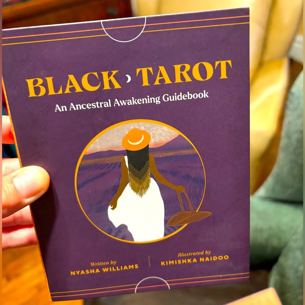 Black Tarot cards with book